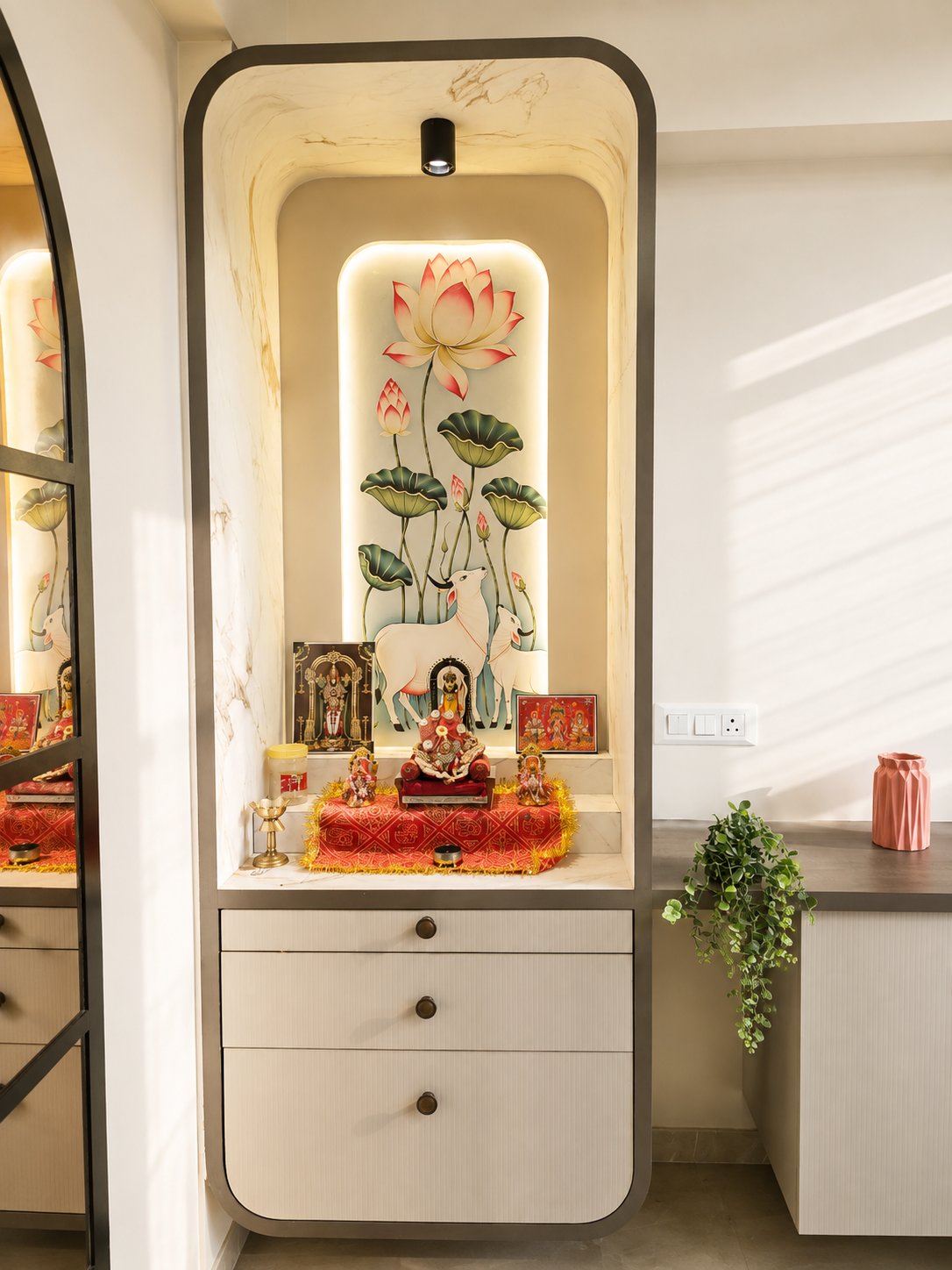 Pooja niche with lotus mural